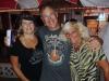 Ted, on break from playing in the Lauren Glick Band, gets a hug from his gal Christine & Diane at Coconuts.