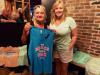 Debbie (owner) & Deanna with Jimmy Charles merchandise.